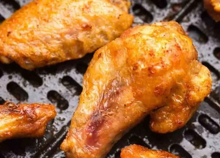Crispy air fryer frozen chicken wings served on a plate