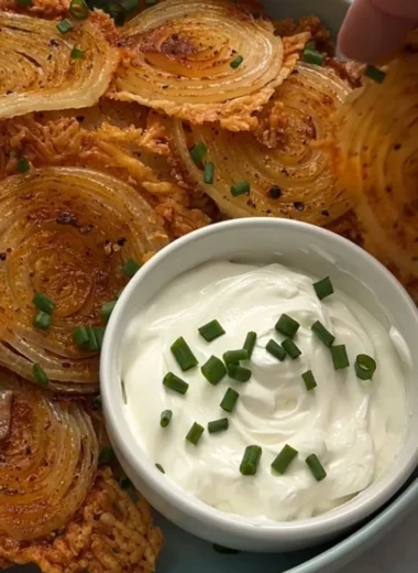 A bowl of crispy onion ring chips ready to be enjoyed as a tasty snack.