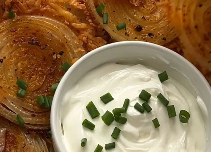 A bowl of crispy onion ring chips ready to be enjoyed as a tasty snack.