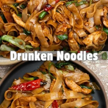 Plate of drunken noodles with vegetables and spices served in Thai cuisine.