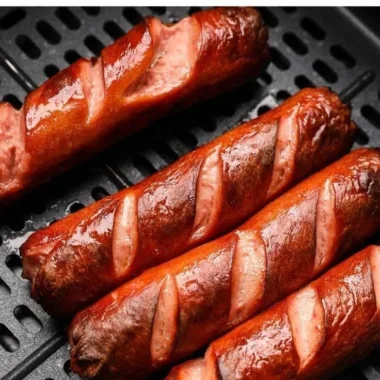 Deliciously cooked air fryer hot dogs served on a plate.