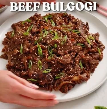 Easy Korean Beef BBQ served on a grill with fresh vegetables