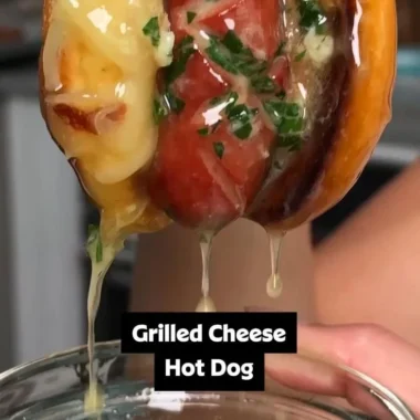 Garlic butter grilled cheese hot dogs served on a plate with melted cheese