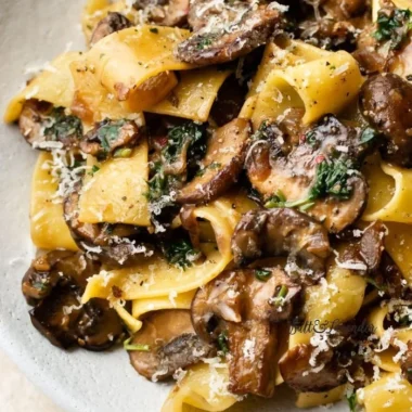 Delicious plate of Garlic Mushroom Pasta topped with fresh herbs
