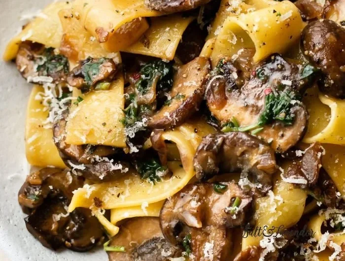 Delicious plate of Garlic Mushroom Pasta topped with fresh herbs