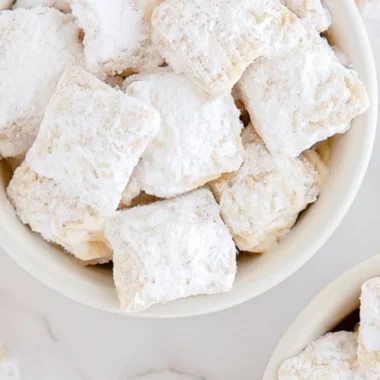 Delicious banana cream pie muddy buddies dessert featuring banana pudding flavors.