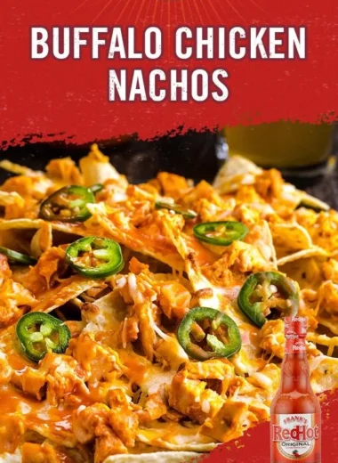 Delicious Buffalo Chicken Nachos topped with cheese and fresh ingredients for a spicy delight.