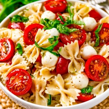 Delicious Caprese Pasta Salad with fresh tomatoes, mozzarella, and basil