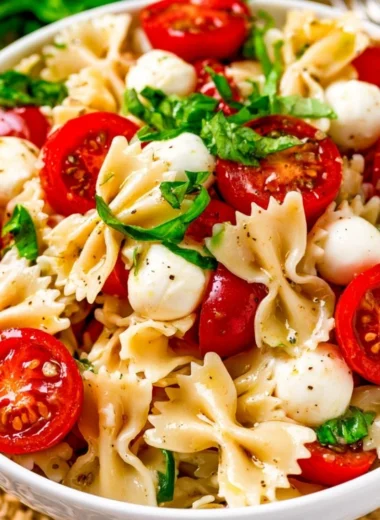 Delicious Caprese Pasta Salad with fresh tomatoes, mozzarella, and basil