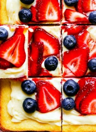 Delicious easy fruit pizza topped with fresh fruits and cream cheese frosting