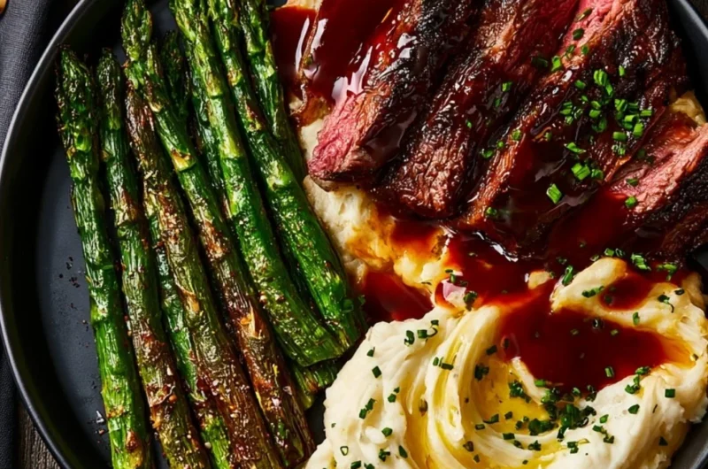 Delicious gourmet steak with mashed potatoes and asparagus on a plate