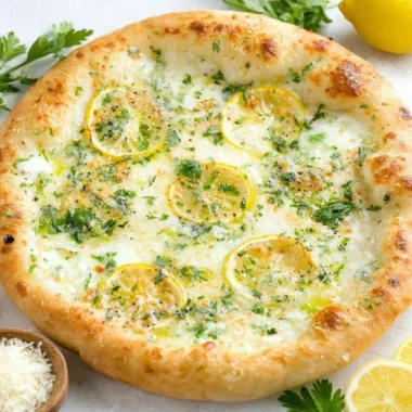Delicious Lemon Pizza topped with fresh ingredients and citrus zest.
