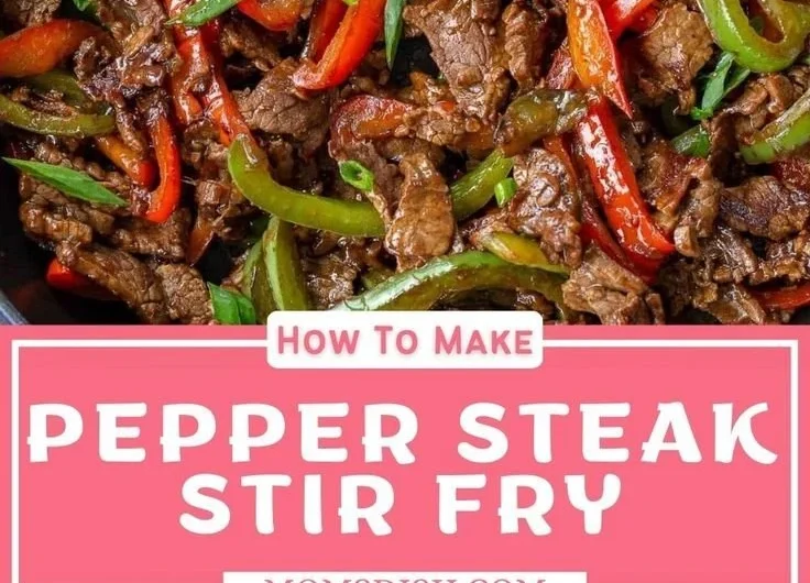 Pepper steak stir fry with colorful vegetables in a sizzling pan