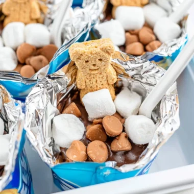 Portable s'mores made with graham crackers, chocolate, and marshmallows outdoors