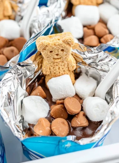 Portable s'mores made with graham crackers, chocolate, and marshmallows outdoors