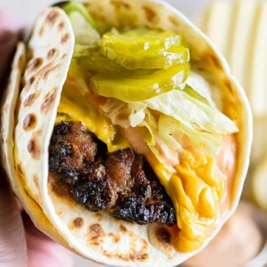 Smash Burger Taco with burger sauce on a wooden board