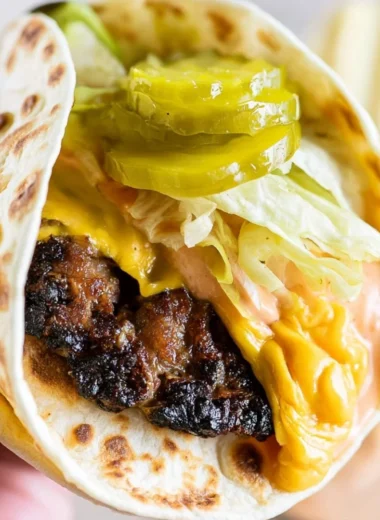 Smash Burger Taco with burger sauce on a wooden board