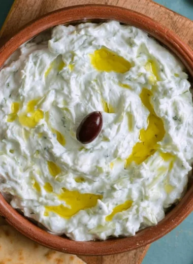 A delicious bowl of Greek tzatziki with fresh cucumbers and herbs
