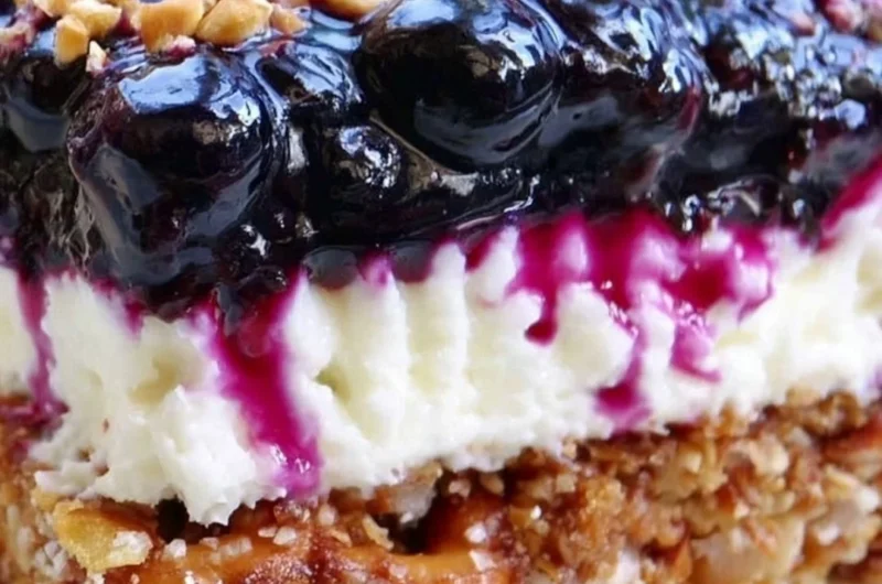 Delicious Blueberry Pretzel Salad with a creamy layer and crunchy pretzel crust