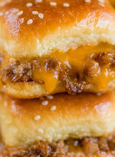 Delicious cheeseburger sliders served on a platter with toppings