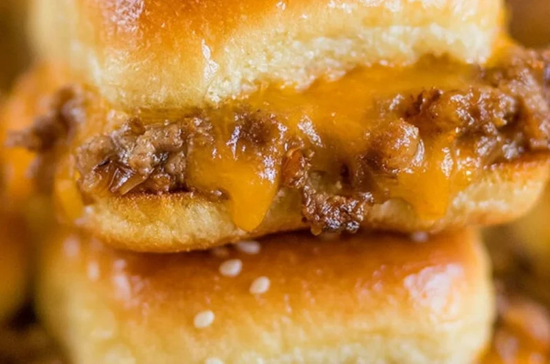 Delicious cheeseburger sliders served on a platter with toppings
