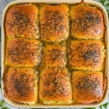 Cozy ham and cheese sliders served warm on a platter