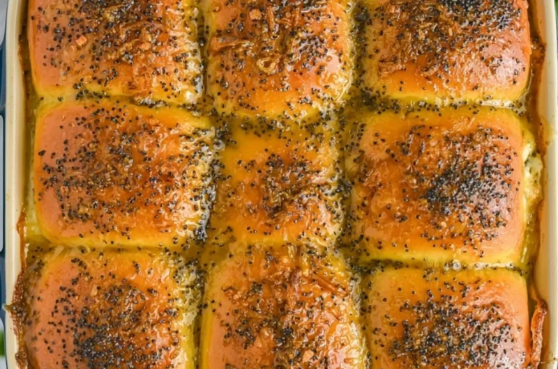 Cozy ham and cheese sliders served warm on a platter