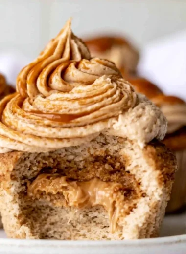 Cozy homemade dulce de leche cupcakes topped with caramel frosting