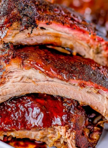 Deliciously tender smoked ribs ready for a weekend gathering.