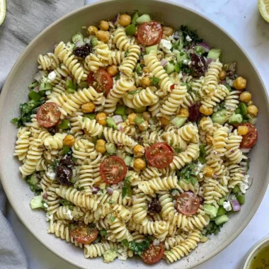 Cozy Vegan Greek Pasta Salad with fresh vegetables and herbs