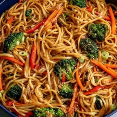 Bowl of cozy vegetable lo mein with colorful vegetables and noodles