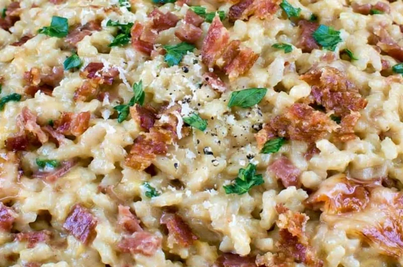 Creamy carbonara risotto garnished with parsley and cheese