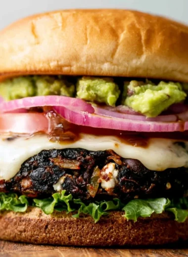 Plate of Ground Turkey Black Bean Burgers with fresh toppings