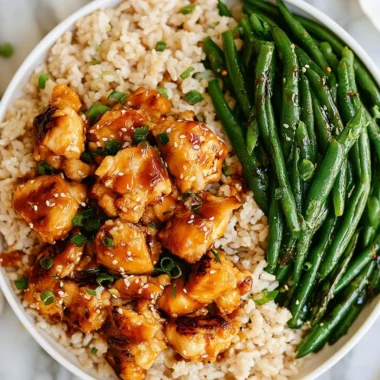 Plate of Honey Garlic Chicken served with green beans for a nutritious meal.