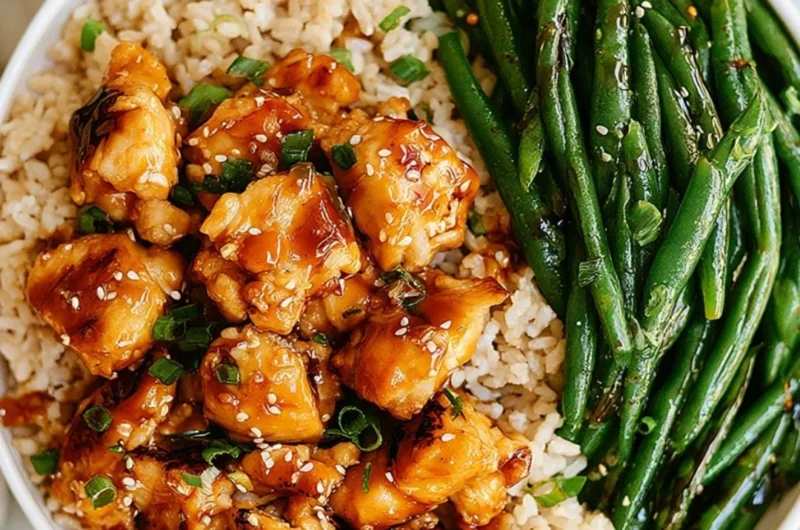 Plate of Honey Garlic Chicken served with green beans for a nutritious meal.
