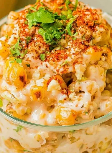 Delicious Mexican Corn in a Cup (Esquites) topped with cheese and spices