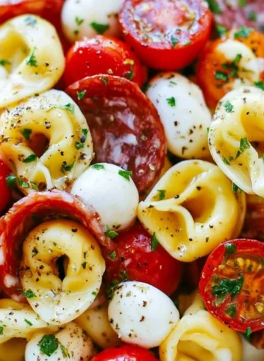 Delicious roasted red pepper and parmesan tortellini salad in a bowl
