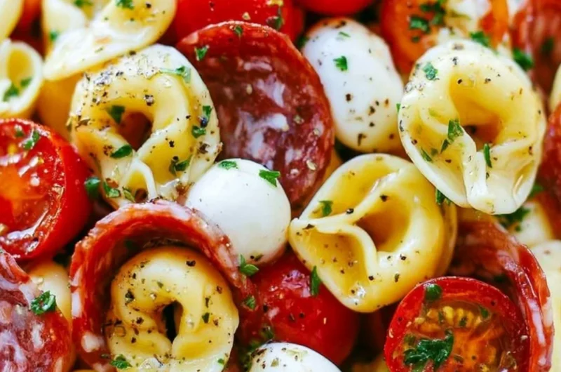 Delicious roasted red pepper and parmesan tortellini salad in a bowl