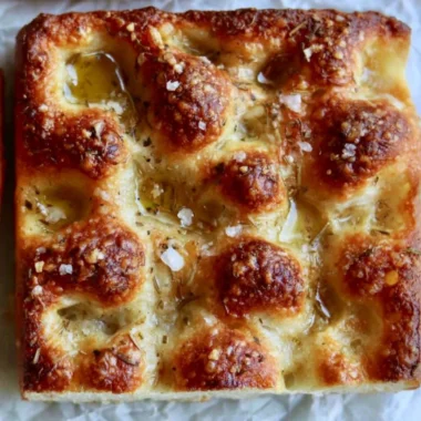 Freshly baked sourdough focaccia with herbs and olive oil
