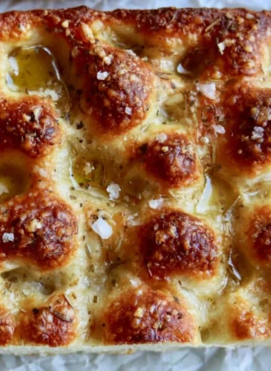 Freshly baked sourdough focaccia with herbs and olive oil