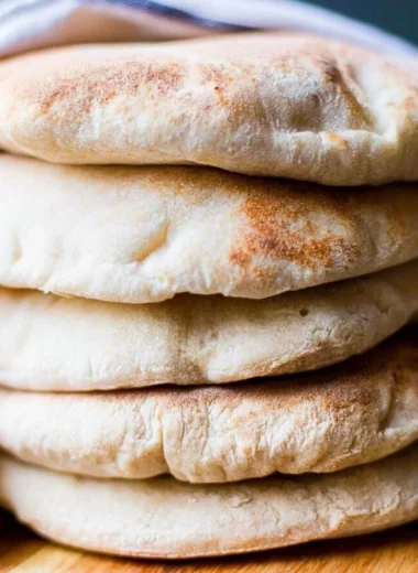 Freshly baked sourdough pita bread served with dips