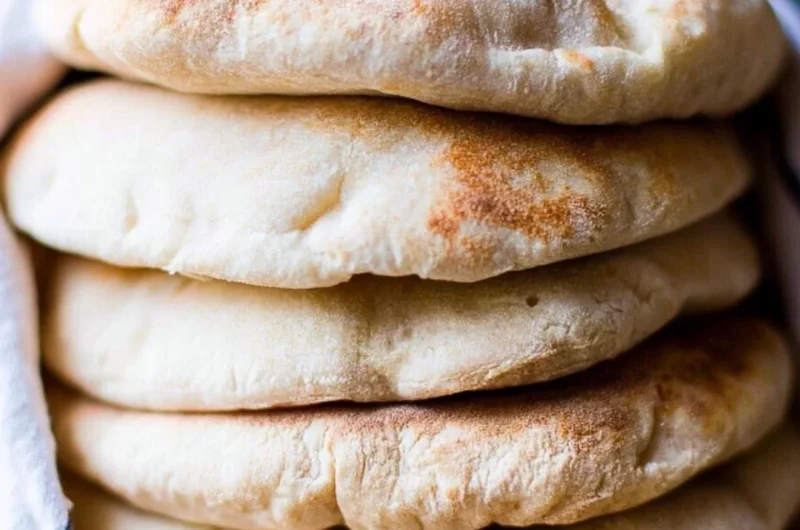 Freshly baked sourdough pita bread served with dips