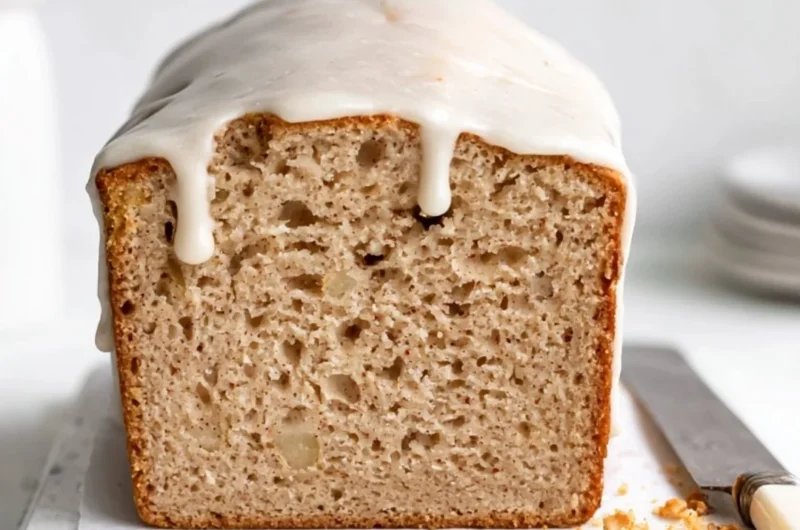Deliciously moist apple spice cake with cinnamon and nutmeg in a cozy setting.