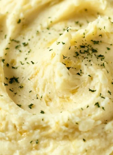 Cozy garlic mashed potatoes served in a bowl with a sprinkle of herbs