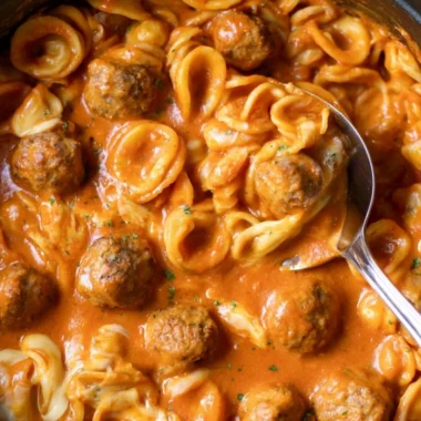 Delicious one pot meatball pasta served with fresh herbs