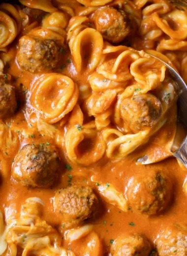 Delicious one pot meatball pasta served with fresh herbs